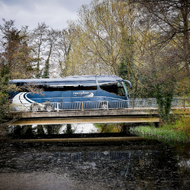 Readybus coach travelling across a bridge