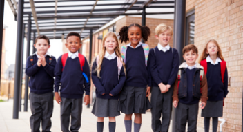 Group of school children coming out of school